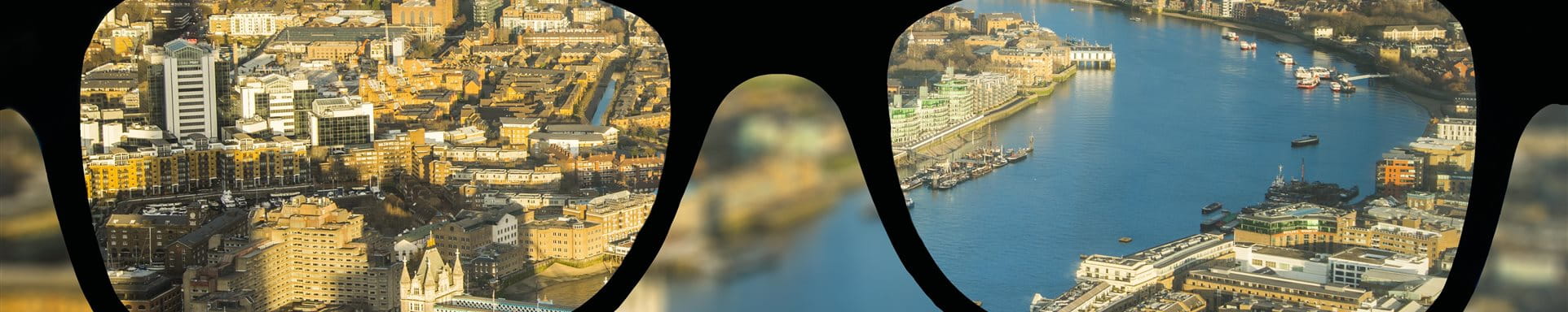 Immobilien Global Schwarze Brille und im Hintergrund ist eine Stadt zu sehen