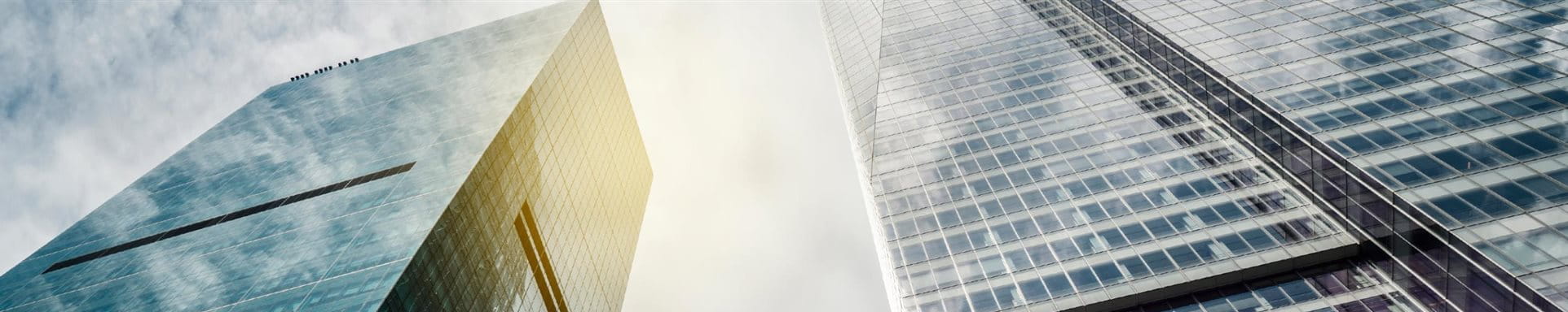 Real Estate USA Three skyscrapers with sky and sun