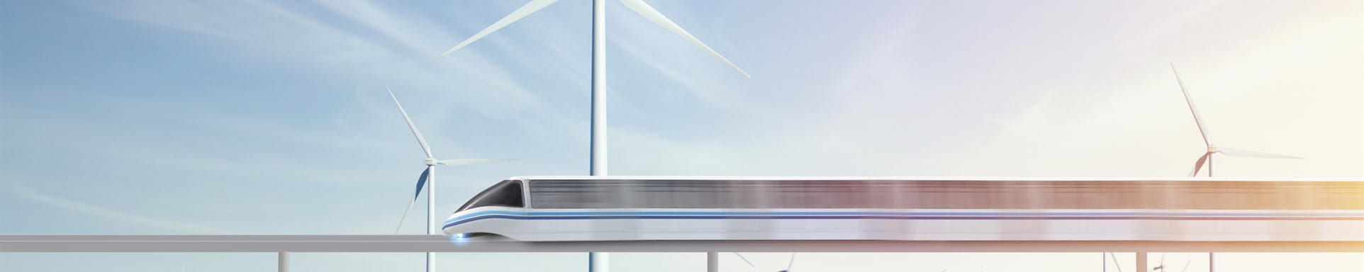 Infrastruktur III Ein fahrender Zug über einer grüne Wiese und Windräder