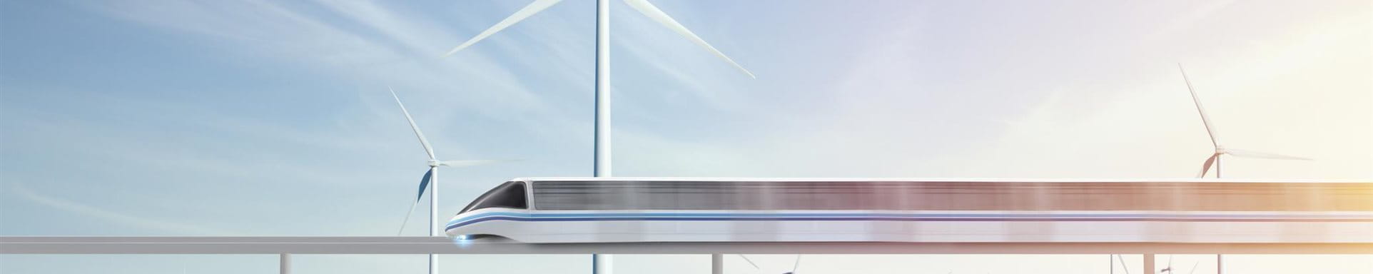 Infrastructure III A moving train over a green meadow and wind turbines